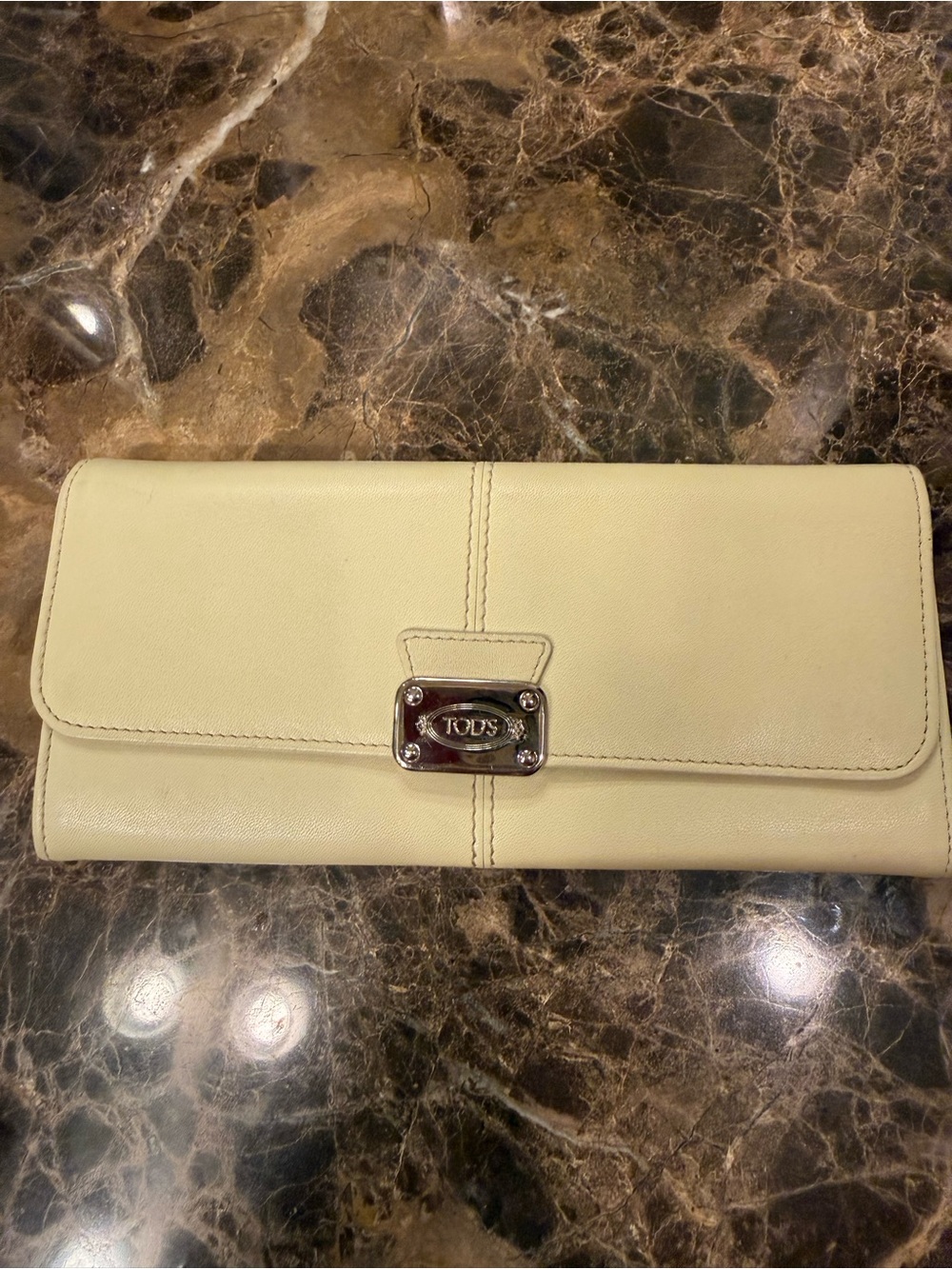 Tod's Light Cream Leather Clutch with Metal Logo Plate